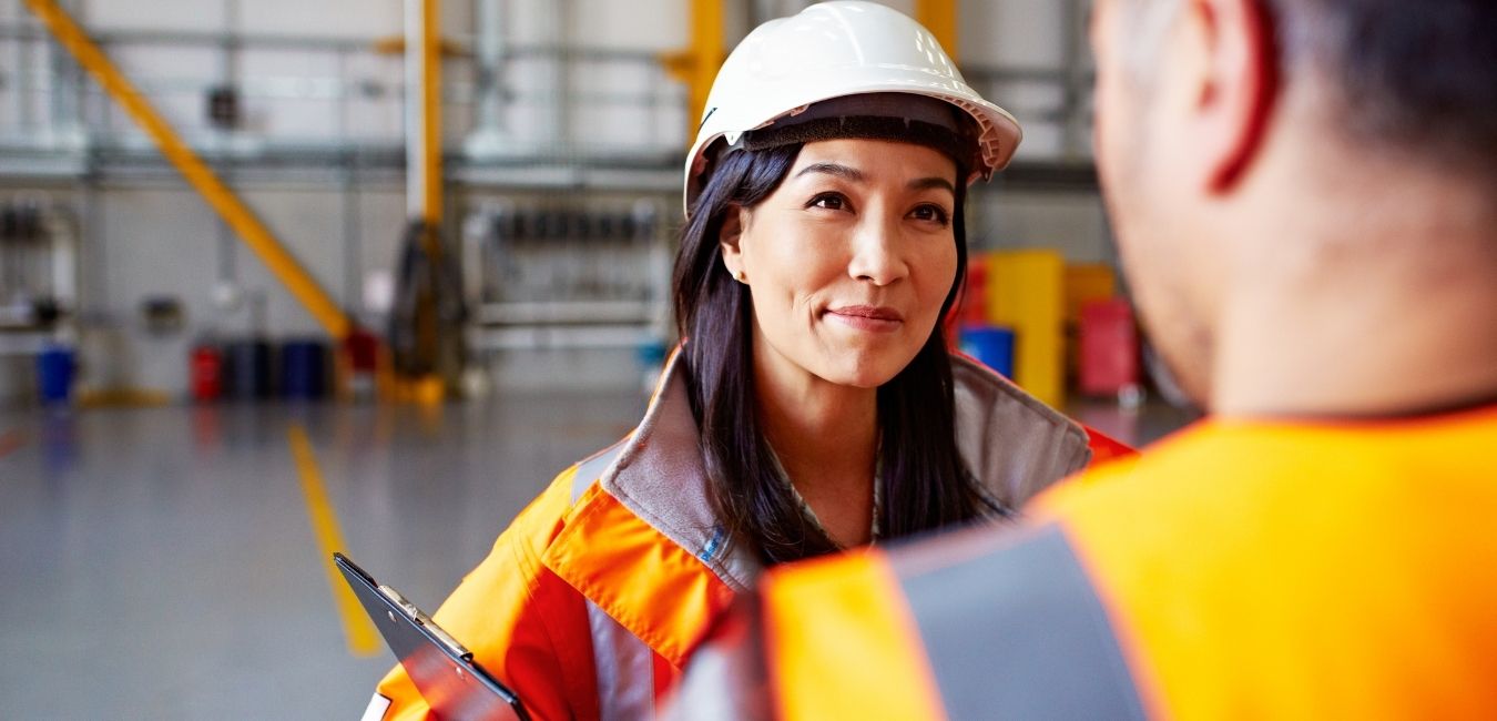 woman in high vis in warehouse